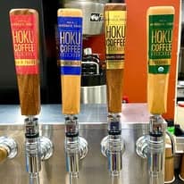 Hoku Coffee tap handles on a draft system