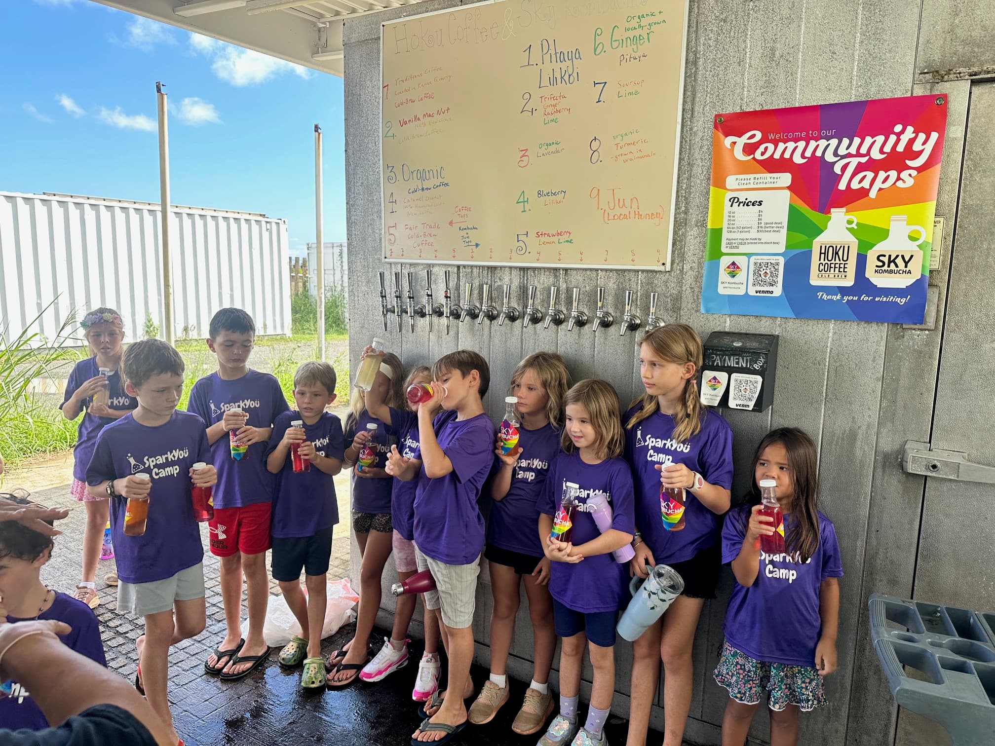 Kids from SparkYou Camp at tap wall
